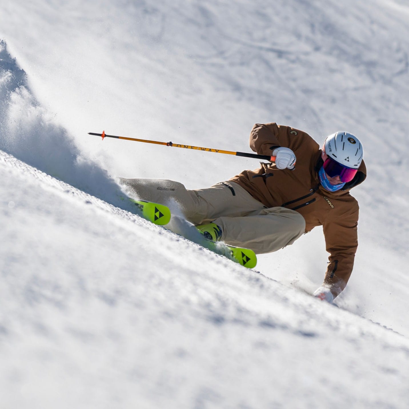 Tomas Mical carving in fresh snow in a Carve jacket